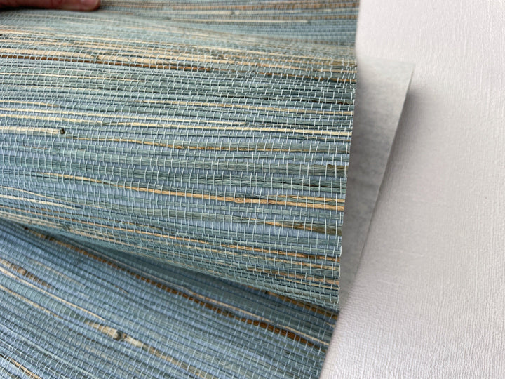 a close up of a person&#39;s hand on a rug