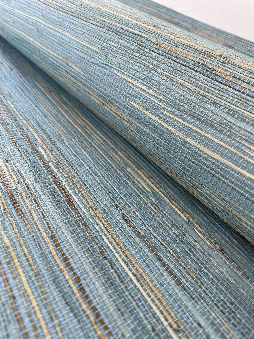 a close up view of a blue and gold striped wallpaper