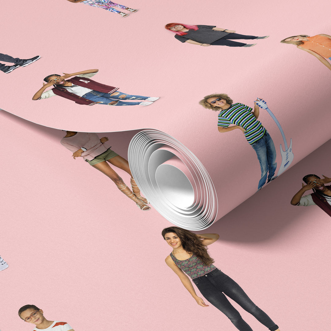 Roll of soft pink cutout people wallpaper with playful character pattern