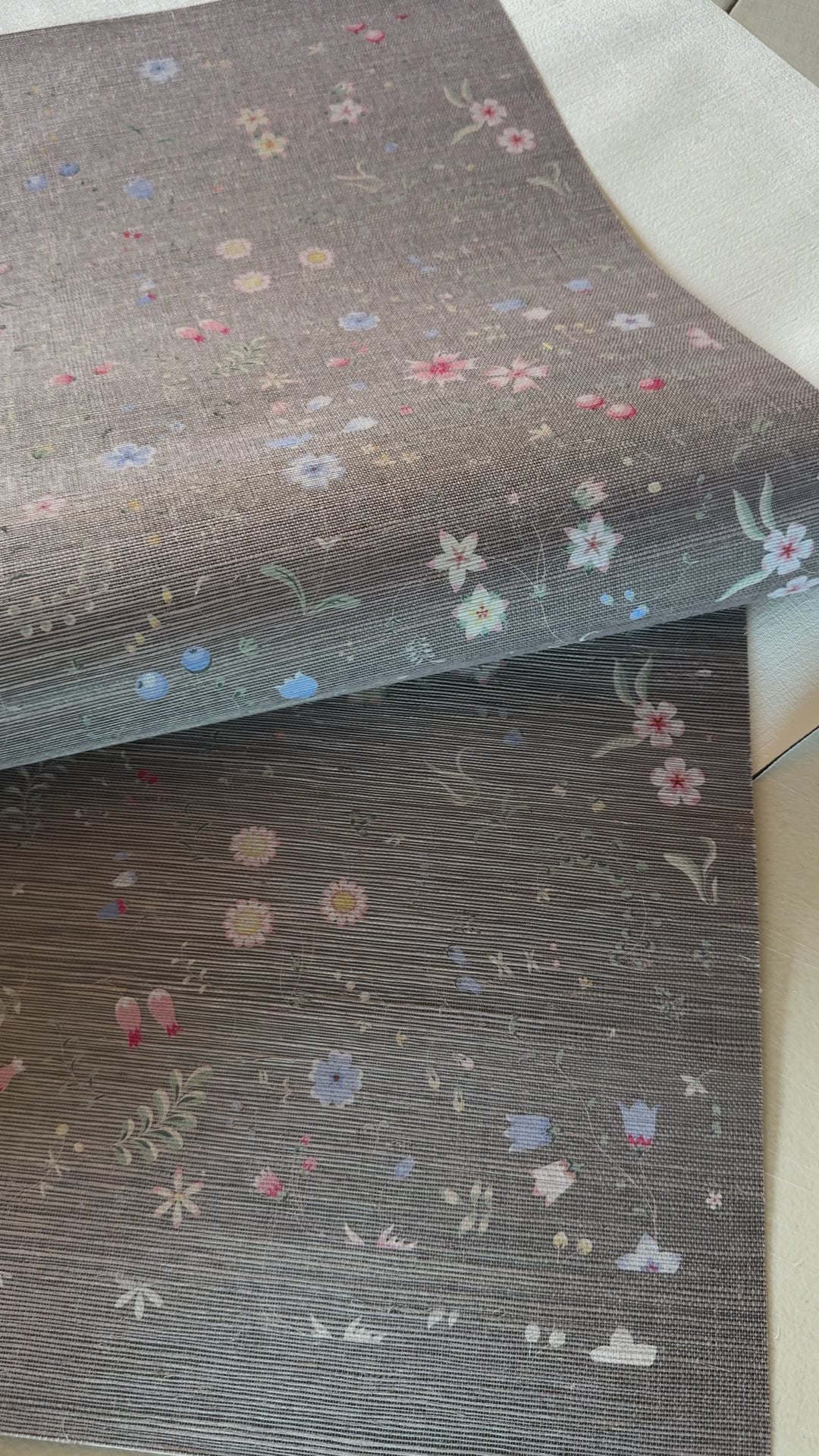 Natural gray sisal wallcovering with colorful wildflowers, berries, and botanical elements printed on woven fibers 93682.
