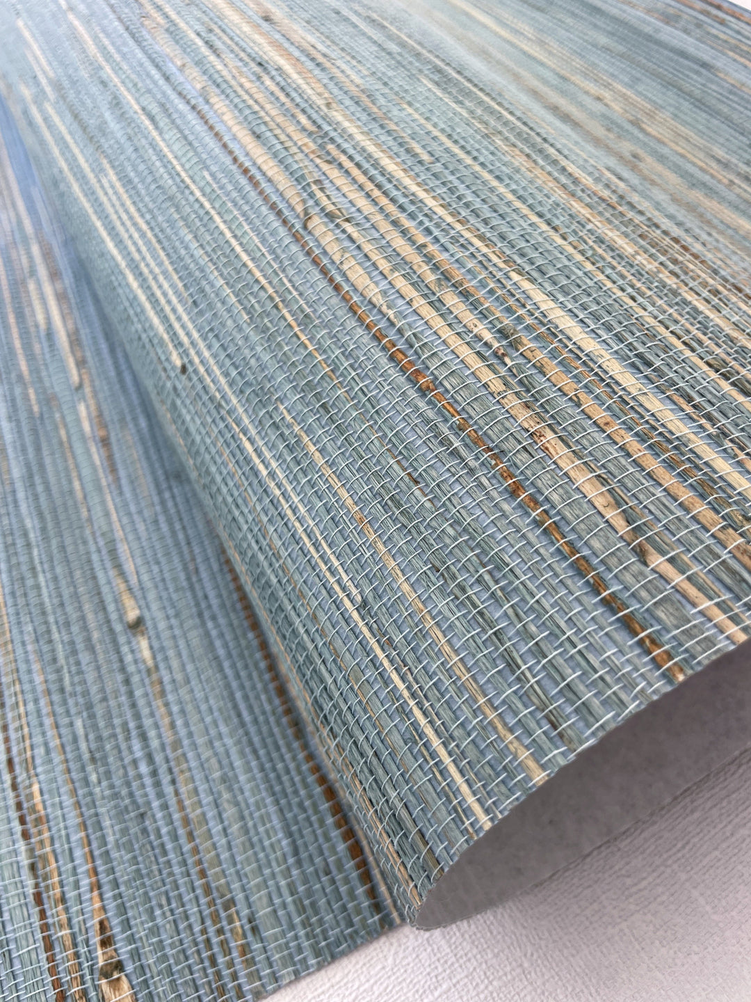 a close up of a blue and beige rug