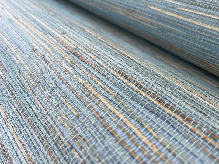 a close up shot of a blue and gold striped fabric