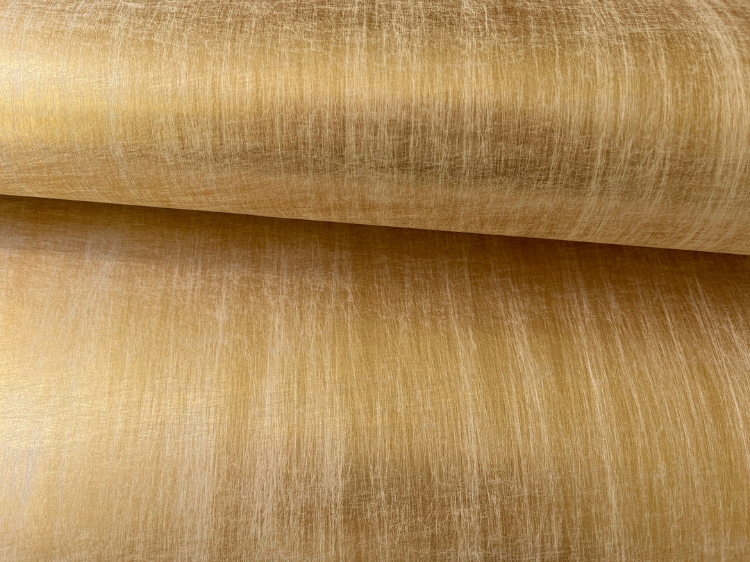 a close up of a gold colored fabric